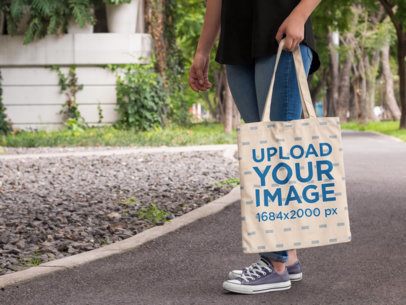 Tote Bag Mockup Featuring a Woman Near a Park