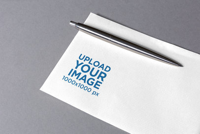 Logo Mockup Featuring a Business Card Placed on a Plain Color Surface 1663-el