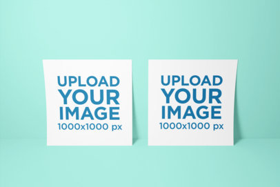 Mockup of Two Squared Flyers Leaning on a Wall