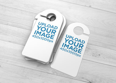 Mockup of Several Door Hangers Stacked on a Wooden Surface 1738-el