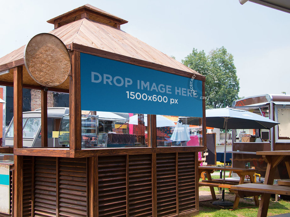 Placeit - Horizontal Banner Mockup Over a Wooden Kiosk
