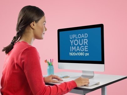 Woman Using iMac at Her Desk Mockup
