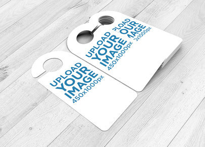 Mockup of Door Hangers Placed over a Wooden-Textured Surface