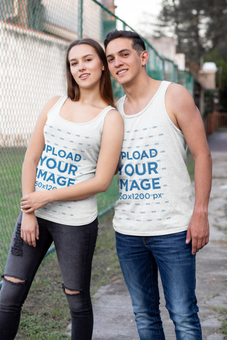 Heather Tank Top Mockup Featuring a Couple Posing at the Park 