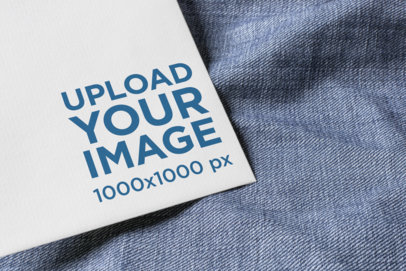 Logo Mockup Featuring a Postcard over a Piece of Fabric