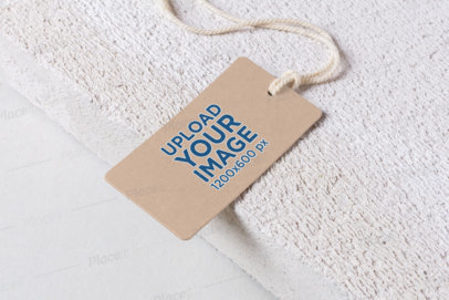 Mockup of a Cardboard Label Tag at the Edge of a Textured Surface 1675-el