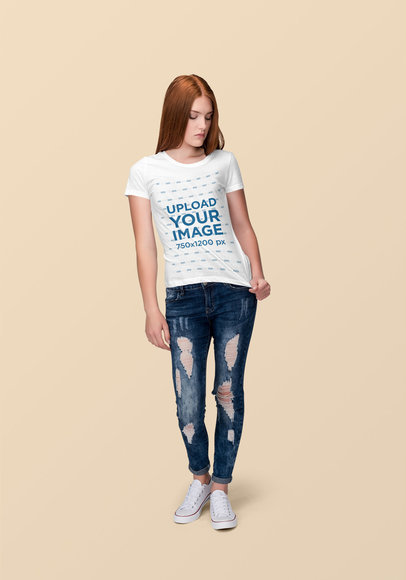 T-Shirt Mockup of a Red-Haired Woman at a Studio