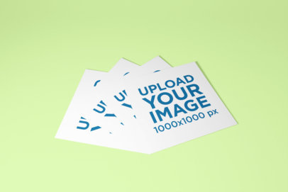 Mockup of a Bunch of Square Flyers on a Customizable Surface