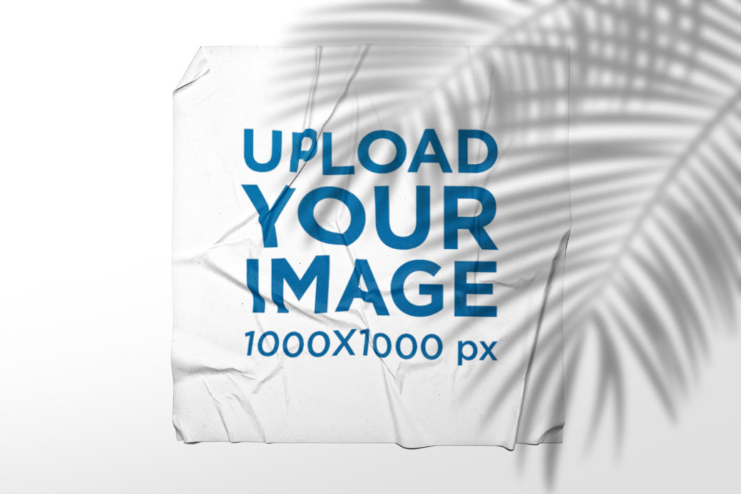 Mockup of a Squared Poster Glued to a Wall Under a Palm Tree Shade