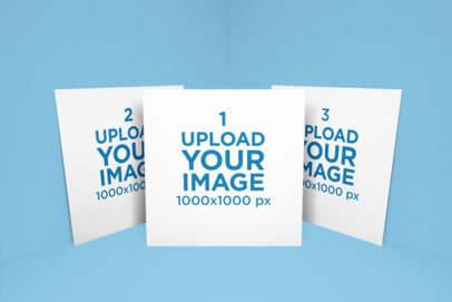 Mockup of a Set of Square Flyers Against a Solid Background