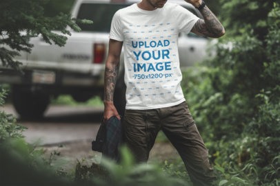 T-Shirt Mockup of a Tattooed Man in the Woods
