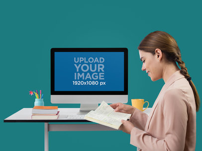 iMac Mockup Featuring a Woman With Her Planner