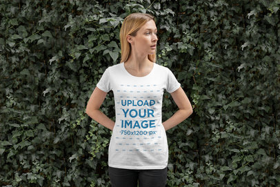 Mockup of a Woman Standing in Front of a Green Wall