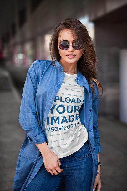 Mockup of a Woman with a Crewneck T-Shirt and Sunglasses Posing on the Street 