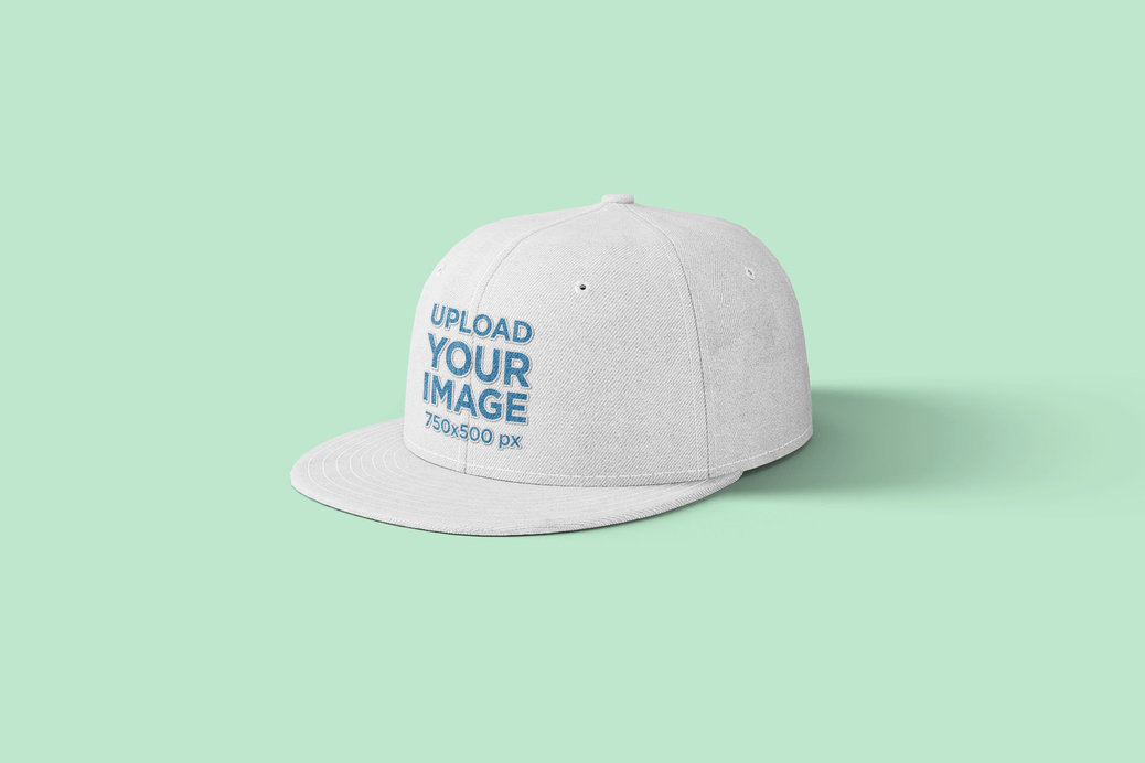 Mockup of a Snapback Hat on a Solid Surface