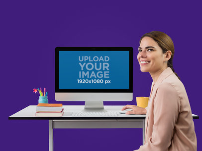iMac Mockup of a Smiling Woman at Her Desk