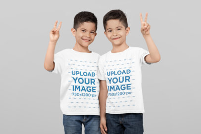 T-Shirt Mockup of Twin Boys Saying Hi at a Studio 