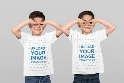 T-Shirt Mockup of Identical Twin Boys Making Funny Faces at a Studio