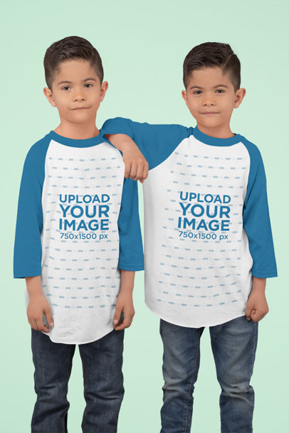 Raglan Tee Mockup Featuring Twins Posing at a Studio