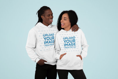 Multiple Hoodies Mockup Featuring a Couple at a Studio