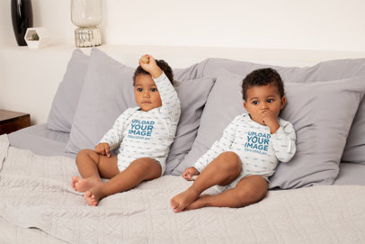 Sublimated Onesie Mockup Featuring Twin Baby Brothers on a Bed