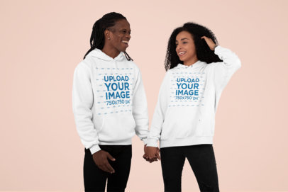 Pullover Hoodie Mockup of a Couple Holding Hands at a Studio