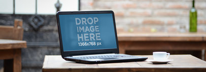 Mockup of a Laptop Placed on a Rustic Wooden Table 