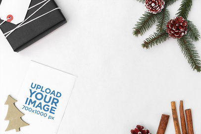 Christmas Mockup Featuring a Postcard Lying on a Pearl-Color Surface