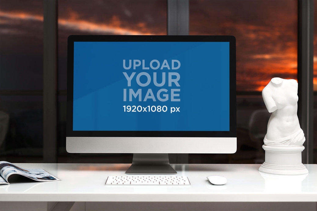 iMac Mockup Featuring a White Office Desk and a Sculpture 