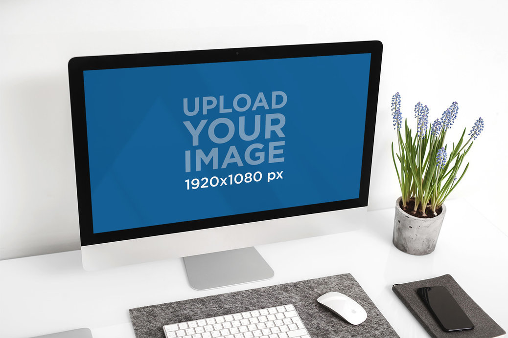 Mockup Featuring an iMac Against a White Wall 
