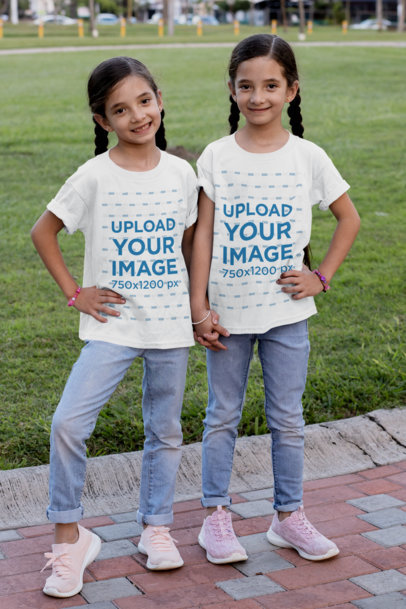 T-Shirt Mockup of Two Identical Twin Girls at the Park 