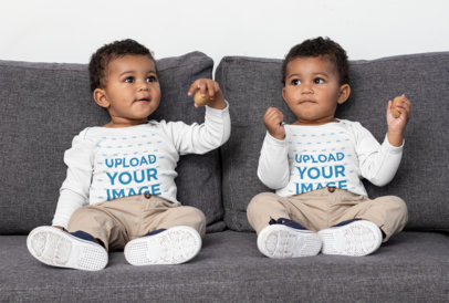 Long Sleeve Onesie Mockup Featuring Two Twin Babies on a Couch