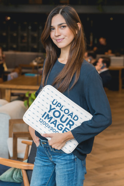 Laptop Sleeve Mockup Featuring a Woman at a Coworking Space