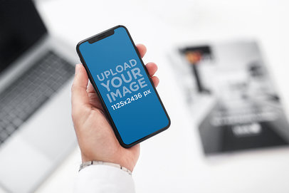 iPhone 11 Pro Mockup Featuring a Man's Hand 