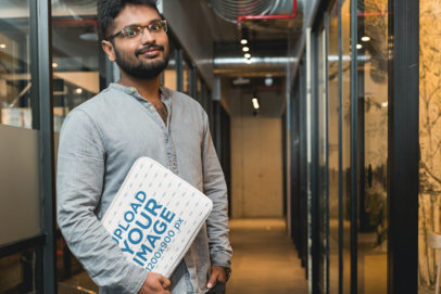 Laptop Sleeve Mockup Featuring a Man at an Office 