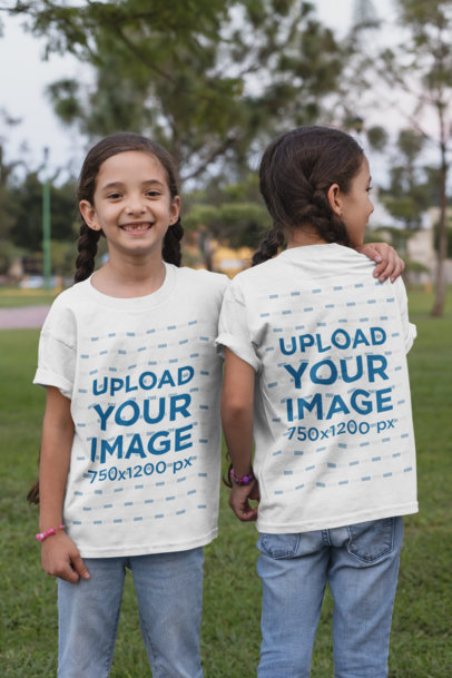 Front and Back View Mockup of Twin Girls Wearing T-Shirts at a Park 