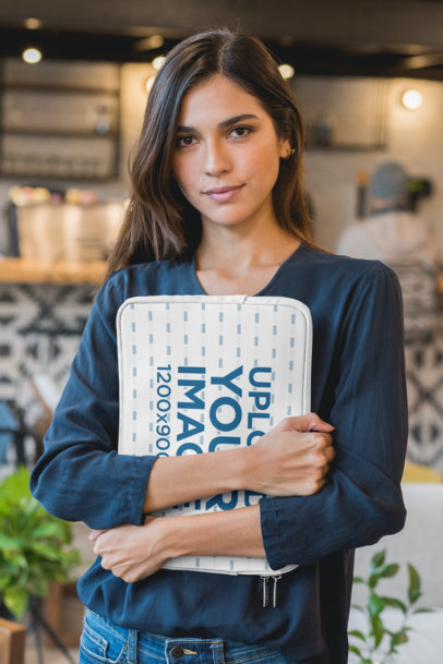 Mockup of a Woman Holding a Laptop Sleeve