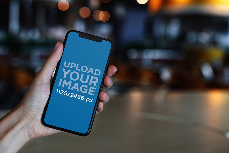 iPhone 11 Pro Mockup Featuring Blurred Lights in the Background 