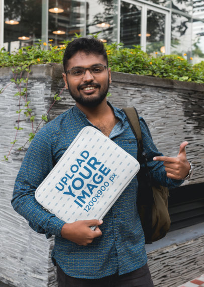Mockup of a Man Pointing at a Laptop Sleeve 