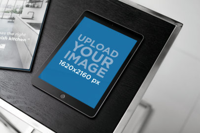Mockup on an iPad Mini Placed on a Dark-Color Table 2115-el