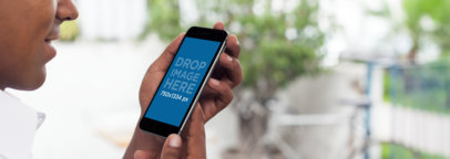 iPhone Mockup of a Young Black Man Using iPhone 6 at a Terrace a4895