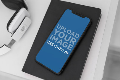Mockup Featuring an iPhone 11 Pro Placed by a Headset 2154-el1