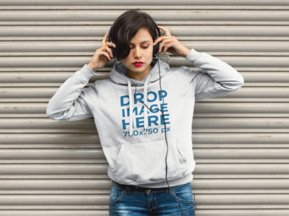 Hoodie Mockup of an Indie Woman Listening to Music