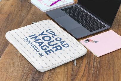 Mockup of a Laptop Sleeve Placed Next to a Computer