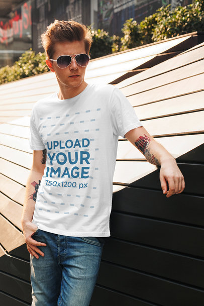 T-Shirt Mockup of a Man with Tattooed Arms 