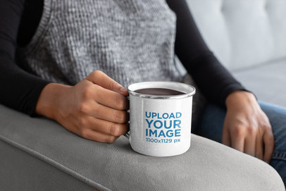 Mockup of a Woman Holding an Enamel Mug with Silver Rim