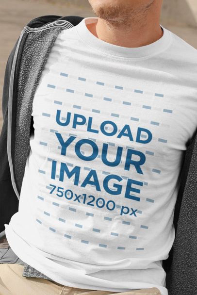 T-Shirt Mockup of a Man Taking His Jacket Off