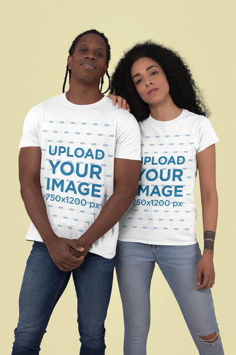 T-Shirt Mockup of a Man and a Woman Posing Against a Plain Color Backdrop