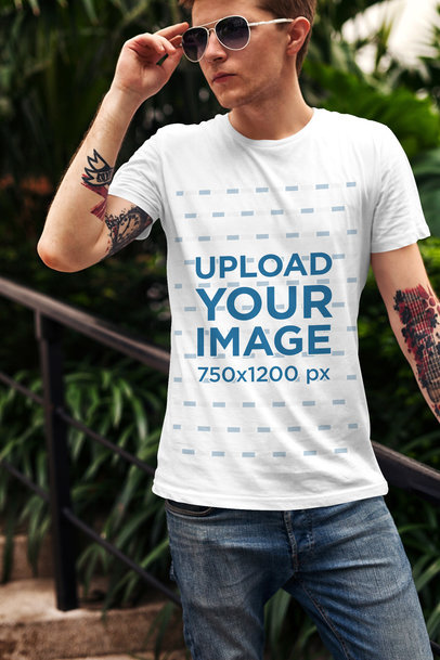 T-Shirt Mockup Featuring a Stylish Man with Tattoos