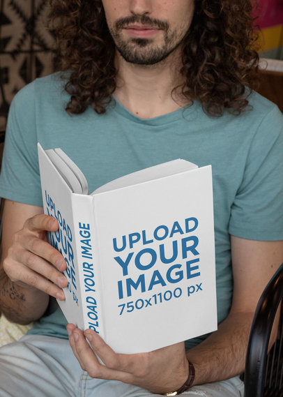 Hardcover Book Mockup Featuring a Bearded Man Reading 